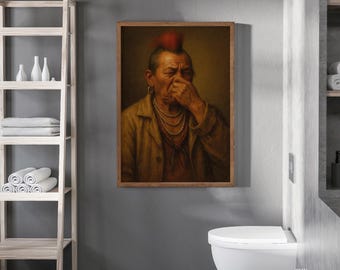 May include: A framed portrait of a man with a red mohawk, wearing a tan jacket and multiple necklaces, touching his nose. The artwork is displayed in a bathroom setting, with a white toilet and a wooden shelf with towels and toiletries.