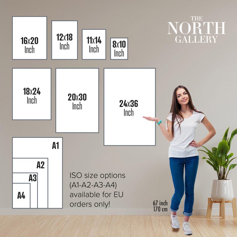 a woman standing in front of a gallery wall, with various sizes of framed artworks displayed on the wall. The gallery offers ISO size options (A1-A3-A4) for EU orders only, ranging from 6" to 17" in height.