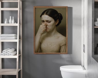 Peut inclure: Une impression encadrée d'une femme se bouchant le nez, avec une expression de détresse. L'œuvre est exposée dans une salle de bain, avec une étagère en bois contenant des serviettes et des articles de toilette, et des toilettes blanches. Le logo The North Gallery est visible.