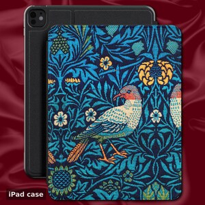May include: iPad case with a colorful bird and floral pattern in blue, teal, and yellow. The case has a black border and is shown with a black iPad. The text "iPad case" is at the bottom.