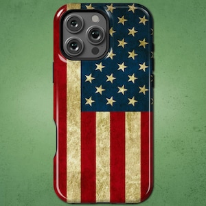 May include: A phone case featuring the American flag design. The case has a red, white, and blue color scheme with a distressed, vintage look. The top portion features a blue field with gold stars, and the bottom has red and white stripes.
