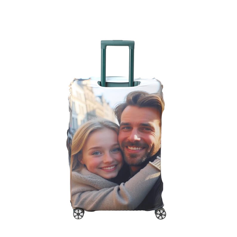 May include: A white suitcase cover with a photo of a couple smiling and hugging. The photo shows a man and a woman in a city setting.