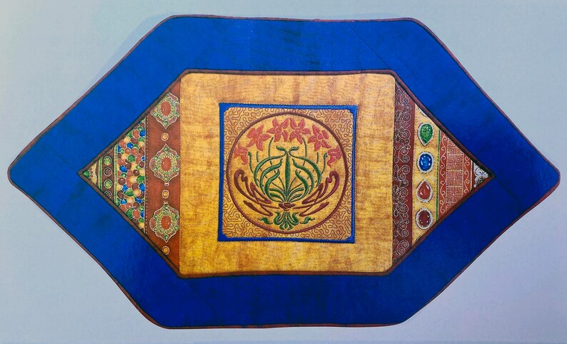 A close up of one of the table mats. It is an elongated hexagon shape with a deep blue border. In the centre is a yellow square with an internal circular motif or a group of flowers. Along the edges of the square, infilling are geometric shapes.