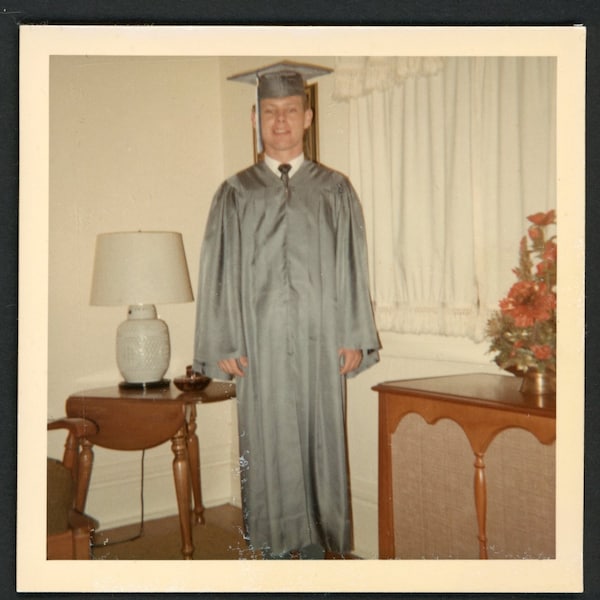 Handsome Man in Blue Graduation Cap and Gown Poses in Living Room Vintage Photo Snapshot 1960s Fashion Man College Cute Guy Graduate