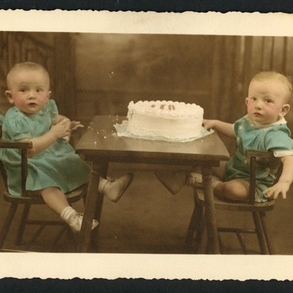 Rosy Cheeked Babies Toddler Twins Seated with Birthday Cake Vintage Studio Portrait Hand Colored Tinted Sepia Photo 1930s Fashion Family