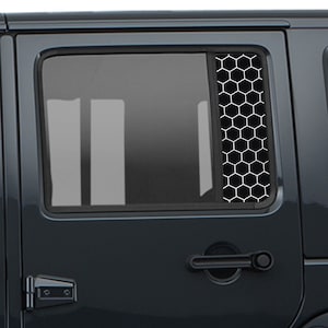May include: Black vehicle window with a honeycomb pattern overlay. The overlay is a vertical strip of white honeycomb shapes against a black background. The vehicle door has a handle and hinges.