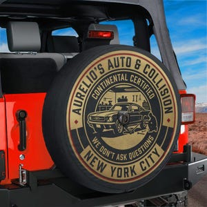 Aurelio Auto & Collision Spare Tire Cover With Backup Camera Hole Option