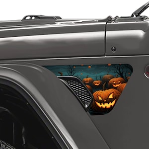 May include: A set of Halloween car decals featuring a dark blue background with a spooky forest scene and glowing jack-o'-lantern pumpkins.