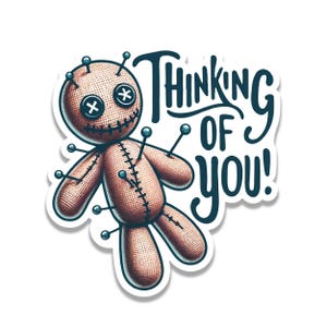 May include: A sticker featuring a tan, textured voodoo doll with black button eyes, stitched mouth, and multiple pins inserted into its body. The text 'THINKING OF YOU!' is written in a dark blue, stylized script font next to the doll figure.