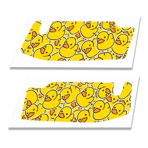 May include: Two rectangular adhesive decals featuring a repeating pattern of yellow rubber ducks with orange beaks. The ducks are densely packed across the surface of each sticker, which has a white border and a cutout section on the right side.