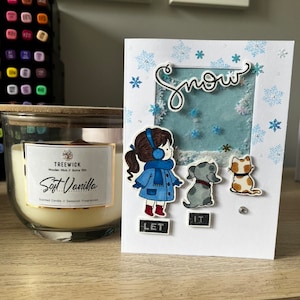 Qu'il neige ! Carte de voeux 3D avec effet chute de neige, une fille, un chien et un chat !