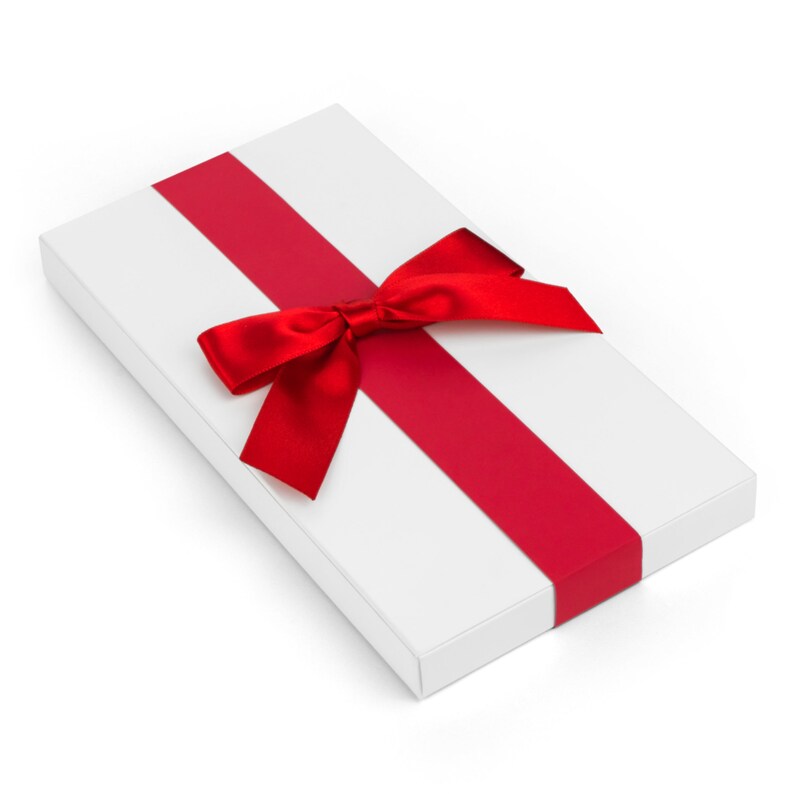 May include: A white gift box with a red ribbon and bow. The box is wrapped in white paper and tied with a red ribbon. The bow is made of a red satin ribbon and is tied in a knot.