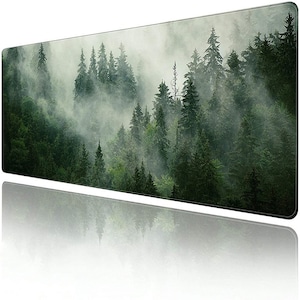 May include: A rectangular mouse pad featuring a misty forest scene. The image showcases a dense forest of tall, green trees shrouded in fog, creating a serene and natural landscape. The pad's design is a long, horizontal rectangle.