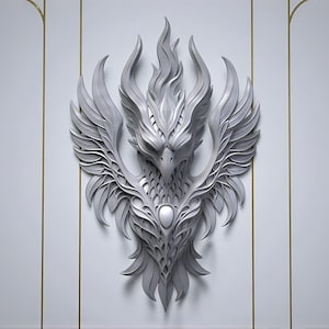 May include: A detailed, grey phoenix wall sculpture with outstretched wings and a central oval design. The sculpture features intricate feather detailing and a flame-like crest, mounted on a white wall with gold trim.