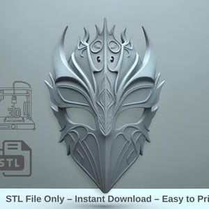 May include: A grey, ornate mask with a detailed, symmetrical design. The mask features pointed edges and decorative patterns. The text "STL File Only - Instant Download - Easy to Print" is at the bottom of the image.