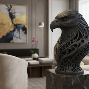 May include: A dark gray eagle bust sculpture with intricate openwork detailing. The sculpture is mounted on a square marble base, showcasing a detailed rendering of the bird's head and neck. The artwork is a decorative piece for home decor.