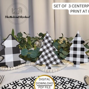May include: Set of three black and white buffalo plaid Christmas tree centerpieces. The trees are printed on cardstock and are ready to be cut out and assembled. The text "SET OF 3 CENTERPIECES PRINT AT HOME" is at the top of the image. The text "DIGITAL DOWNLOAD PDF FILE" is at the bottom of the image.