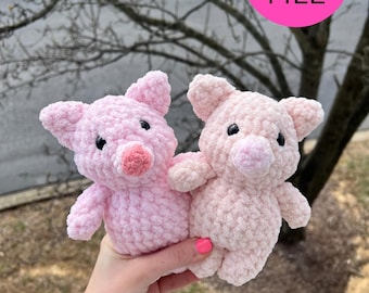May include: Two handmade crochet pig stuffed animals in shades of pink. The pigs have small black eyes and pink snouts. The image includes a pink circle with the text "PDF FILE".