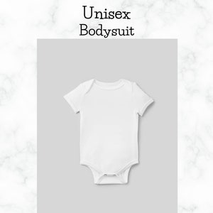May include: A white unisex bodysuit with short sleeves. The garment is displayed on a light gray background, with the words "Unisex Bodysuit" in black text above. The background is a marble pattern.