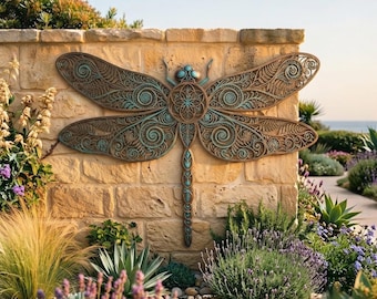 May include: A large, decorative dragonfly wall sculpture featuring intricate, openwork metal patterns with a bronze finish and teal-colored accents. The design includes symmetrical wings with swirling filigree details and a central circular body.