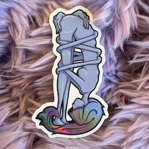 May include: A sticker featuring a stylized illustration of two figures intertwined. The figures are in a light blue color, with a swirling design at the base in iridescent colors. The figures are wrapped in a rope-like design.