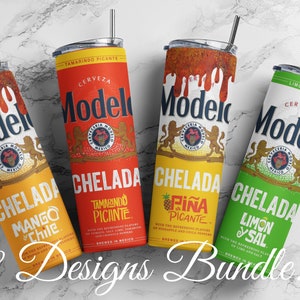 May include: Four stainless steel tumblers with lids and straws, featuring a Modelo beer label with different chelada flavours: Mango & Chile, Tamarindo Picante, Piña Picante, and Limon y Sal. The tumblers are arranged on a white marble surface.