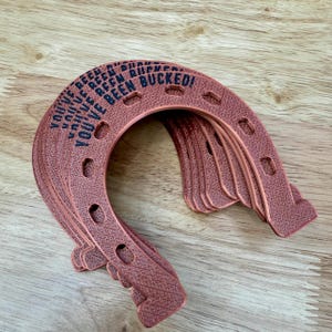 You’ve Been Bucked set of 10 horseshoes for Bronco fans (Rose Gold)