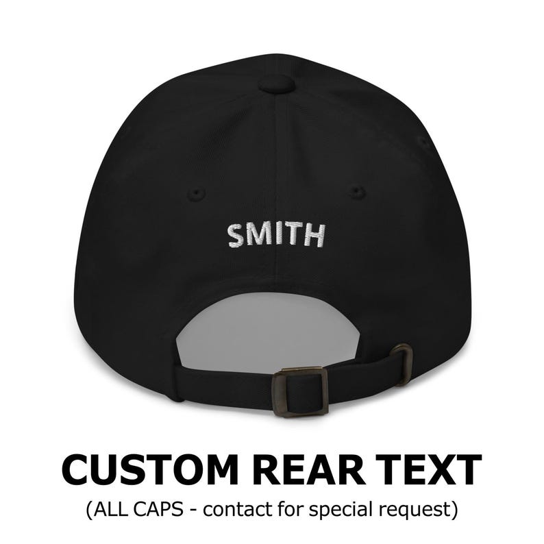 May include: Black baseball cap with a white embroidered text "SMITH" on the back. The cap has an adjustable strap.