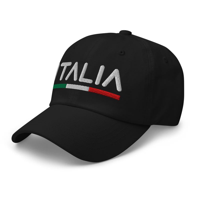 May include: A black baseball cap with white embroidered text that reads "ITALIA" and a small Italian flag above the text.