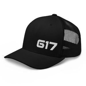 May include: Black and white trucker hat with a white embroidered "G17" on the front.