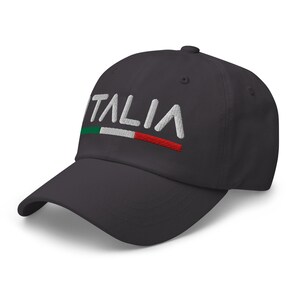 May include: A dark gray baseball cap with the word "ITALIA" embroidered in white with a green, white, and red stripe underneath.