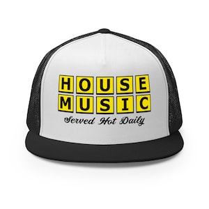 May include: A black and white trucker hat with a white front panel and a black mesh back. The front panel features the words "HOUSE MUSIC" in yellow block letters with the text "Served Hot Daily" underneath.