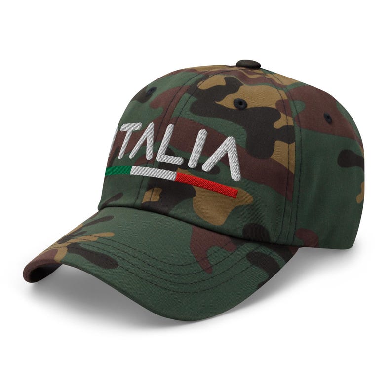 May include: A camouflage baseball cap with the word "ITALIA" embroidered in white with a red, white, and green stripe underneath.