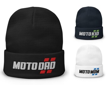 May include: Three beanies in black, navy, and white. The black beanie has the text "MOTO DAD" in white with red accents. The navy beanie says "MOTO KID" in white with green accents. The white beanie says "MOTO MOM" in black with blue accents.