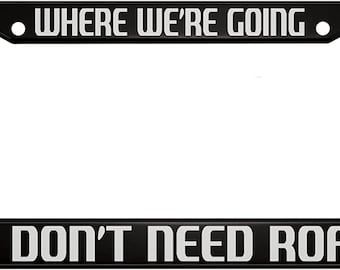 We're Going We Don't Need Roads Black License Plate Frame