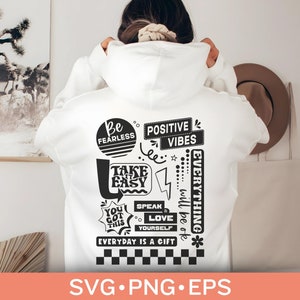 Puede incluir: Sudadera blanca con un diseño gráfico negro que presenta frases motivacionales como "Be Fearless", "Take it Easy", "Positive Vibes", "Speak Love Yourself" y "Everything will be ok".