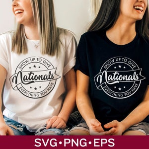 May include: Two women wearing white and black t-shirts with a black and white circular design that says "Show Up To Give Nationals Everything You Have".