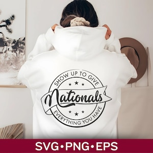 May include: White hoodie with a black and white circular design that says "Show Up To Give Nationals Everything You Have".