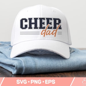 May include: White baseball cap with a navy blue "Cheer dad" graphic in a vintage style font. The text is outlined in black and has three black stripes underneath.