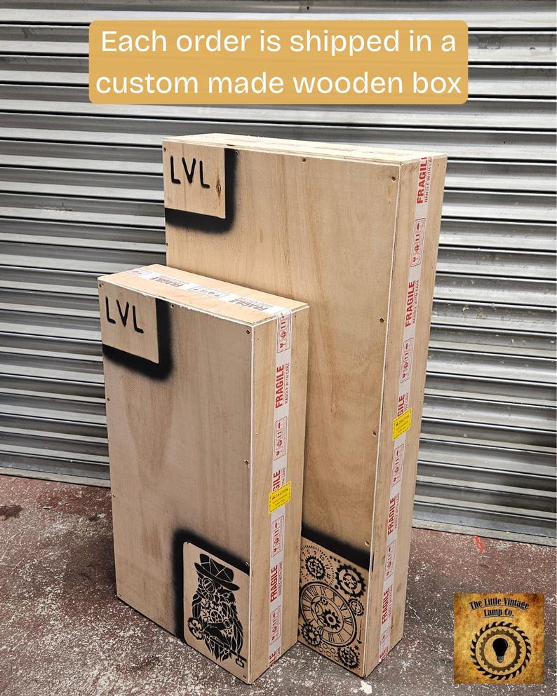 May include: Two custom-made wooden boxes, one large and one small, are shown. The boxes are made of light-colored wood and feature black stenciled designs and the text "LVL". The boxes are sealed with "Fragile" tape.