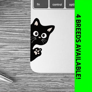 May include: Black cat sticker peeking around the corner of a laptop. The sticker has white eyes and a paw print. The text "4 BREEDS AVAILABLE!" is on the right side of the image.