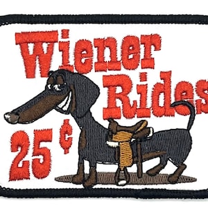 May include: Embroidered patch featuring a cartoon dachshund wearing a saddle with the text "Wiener Rides" and "25¢" in red.