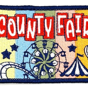 May include: Embroidered patch with a colorful striped background and the text "COUNTY FAIR" in red letters. The patch features a Ferris wheel, a roller coaster, a tent, and a hot air balloon.