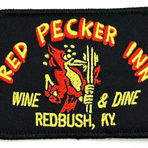 May include: Red Pecker Inn embroidered patch with a red bird holding a bottle of wine. The text reads "Red Pecker Inn Wine & Dine Redbush, KY."