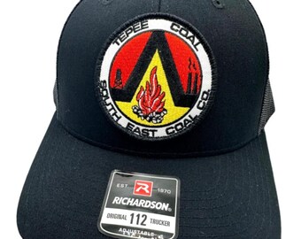 May include: Black trucker hat with a red, yellow, and black embroidered patch that says "South East Coal Co." and a smaller patch that says "Richardson® 112 Trucker".