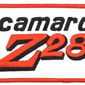May include: Red and black embroidered patch with the text "Camaro Z28" on a white background.