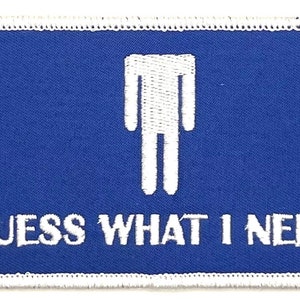 May include: Blue and white embroidered patch with a stick figure and the text "GUESS WHAT I NEED".