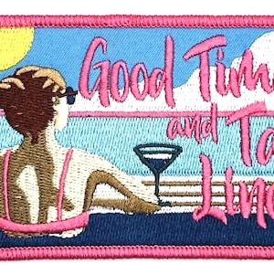 May include: Embroidered patch with a pink border, featuring a woman in a pink swimsuit relaxing by a pool with a cocktail. The text "Good Times and Tan Lines" is in pink lettering.