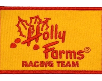 May include: Red and yellow embroidered patch with the text "Holly Farms Racing Team" and a stylized holly leaf design.