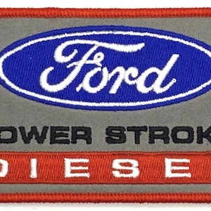 May include: A gray embroidered patch with the Ford logo in blue and white, the words "POWER STROKE" in black, and "DIESEL" in red.